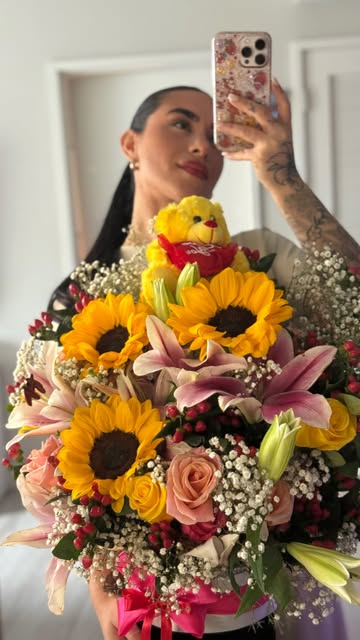 Tall sunflower, rose and lily arrangement in a black keepsake box